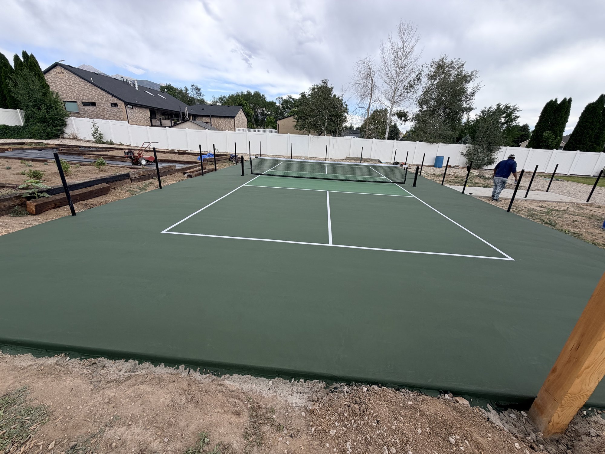 New green tennis and pickleball court in Utah, sloped for proper drainage