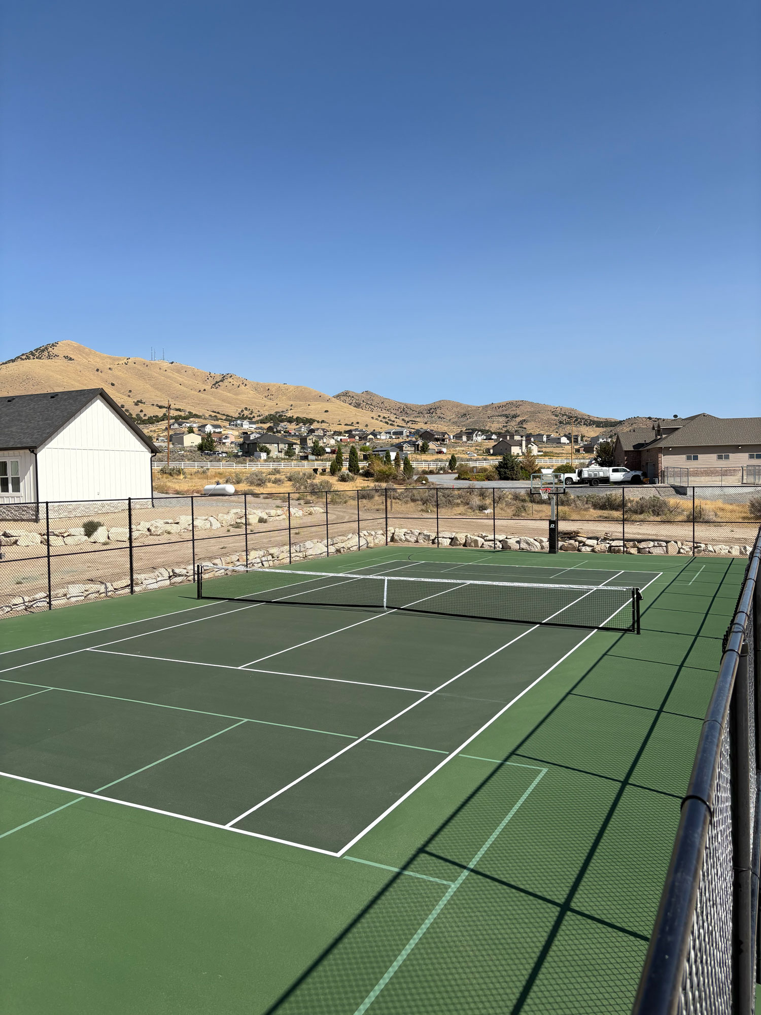 Professional tennis court construction in Utah with proper surface preparation