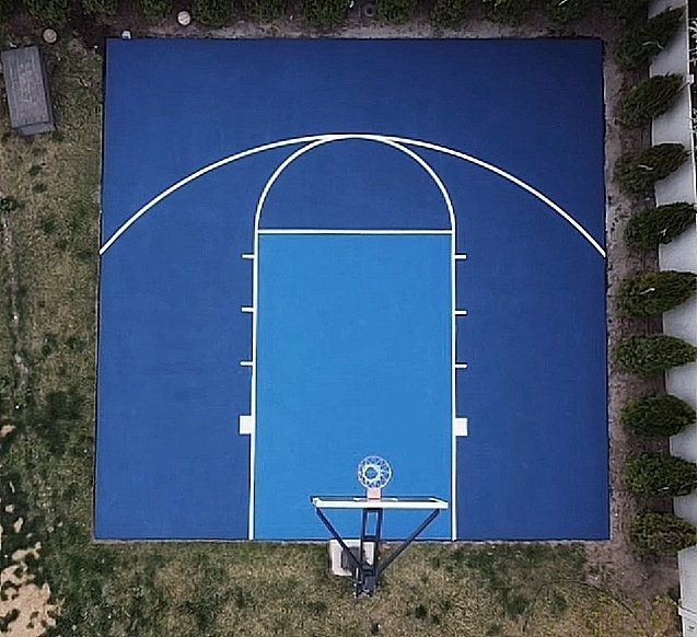 Aerial Drone View of Custom Blue Backyard Basketball Court by Precision Pro Courts
