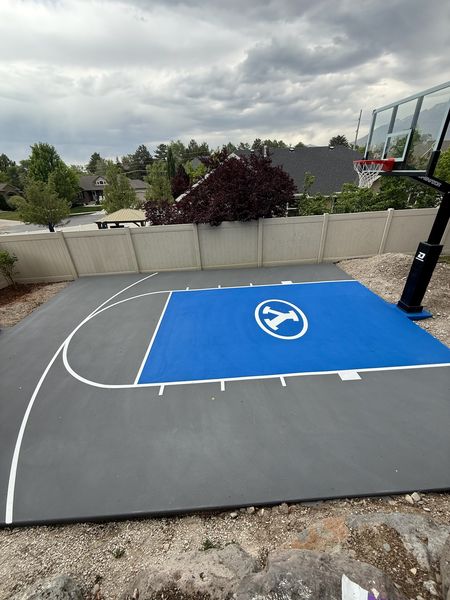 Grey and Blue Backyard Basketball Court with BYU Logo by Precision Pro Courts