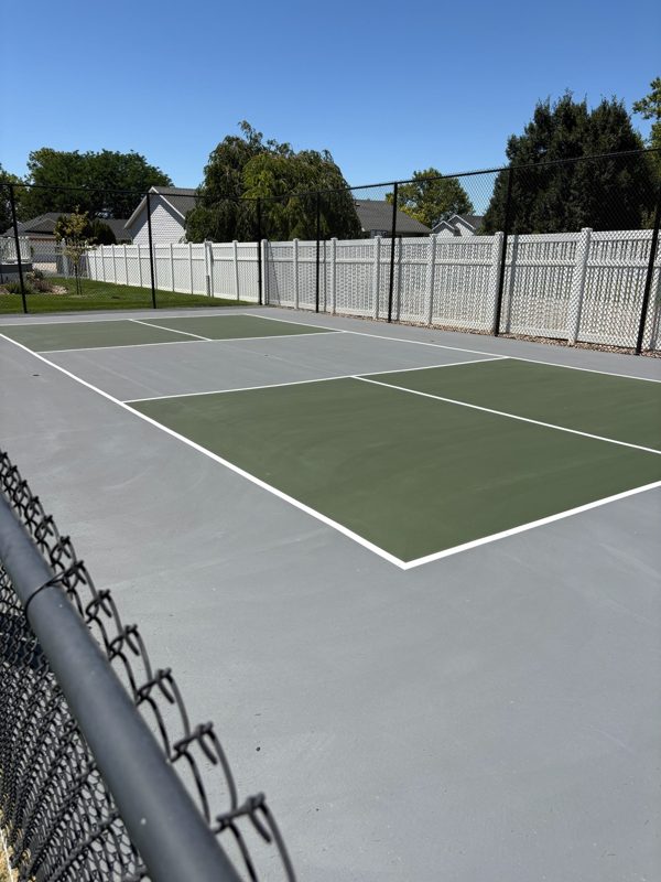 Backyard Green and Grey Pickleball Court with White Vinyl Fence by Precision Pro Courts