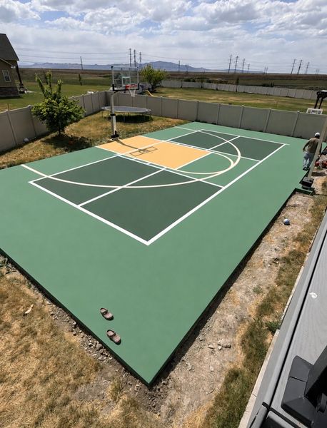 Green and Tan Backyard Basketball Court with Valley View by Precision Pro Courts in Utah