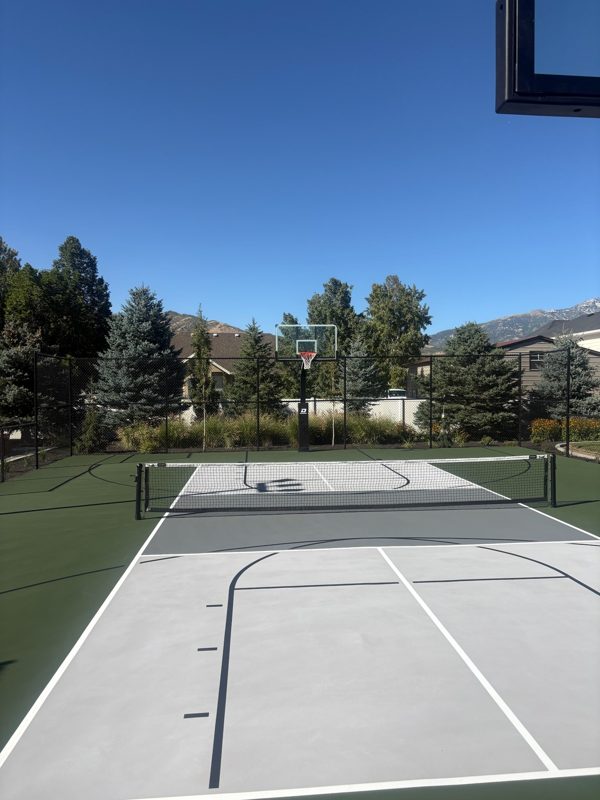 Backyard Multi-Sport Court with Basketball Hoop and Pickleball Net and Mountain Views by Precision Pro Courts