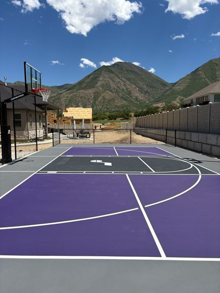 Purple and Charcoal Backyard Basketball Court with Mountain View by Precision Pro Courts