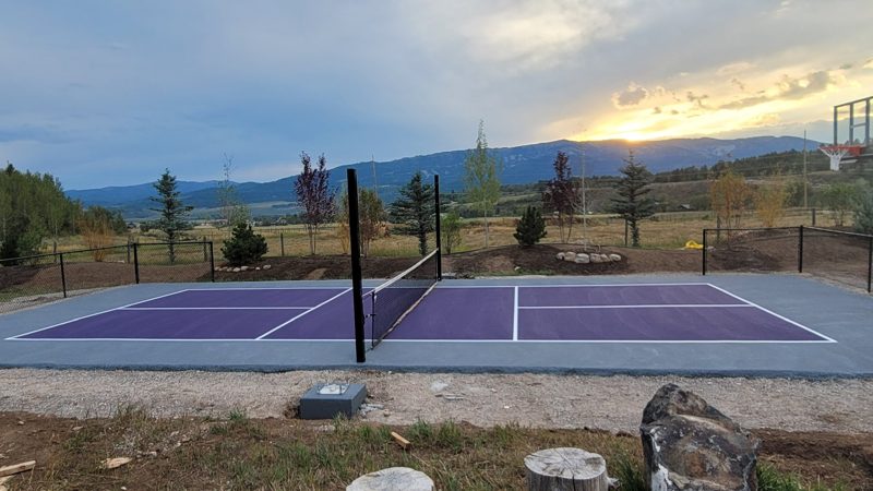 Purple Backyard Pickleball Court at Sunset with Mountain Views by Precision Pro Courts